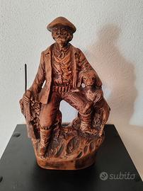 statua uomo con cane