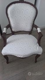 Poltrona con braccioli. 