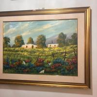 Paesaggio con casale e campo fiorito