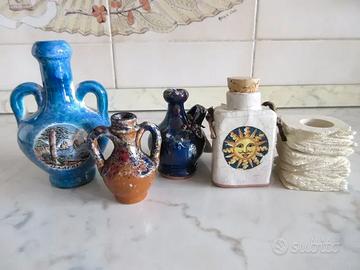 Souvenir. Anfore in ceramica e portacandela pietra