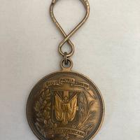 Portachiavi vintage a forma di moneta “1 Peso”