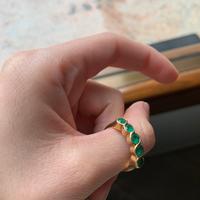 Anello in oro 18k con 5 smeraldi