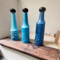 tre bottiglie di Savador Dalì 