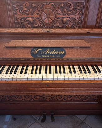 Pianoforte a muro in legno con intarsi “F Adam”