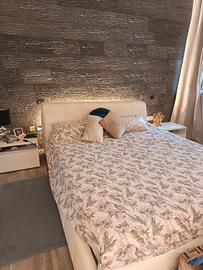 Letto contenitore in vera pelle.