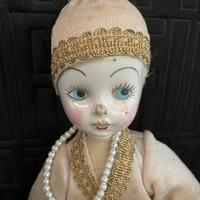 Bambola di pezza con viso in ceramica