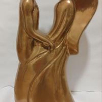 Simbiosi, scultura laccata oro