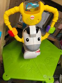 Zebra saltella e gira Fisher price con luci e. esu