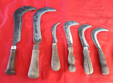 Roncole antiche con manico di legno