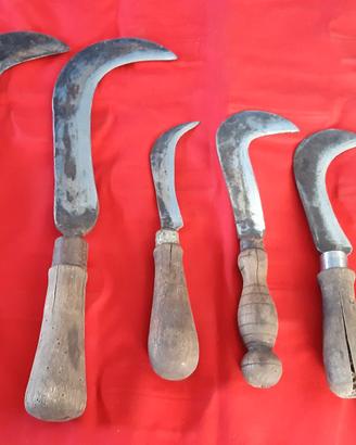 Roncole antiche con manico di legno