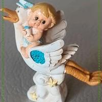 Bomboniera cicogna con bambino