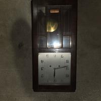 orologio antico con pendolo