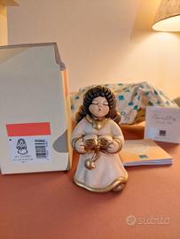 Thun Angelo con libro