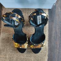 Scarpe donna in paillettes girabrilla nero/oro.