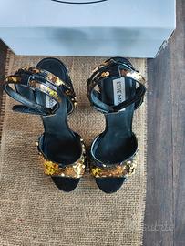 Scarpe donna in paillettes girabrilla nero/oro.