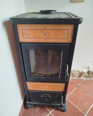 stufa a legna con canna fumaria completa a  tetto 