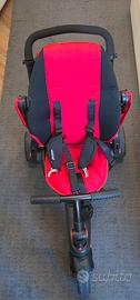 SmarTrike triciclo per bambini rosso e nero.