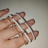 3 bracciali bianco e oro