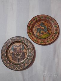 piatti decorativi in terracotta vintage