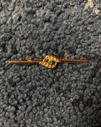Spilla vintage dorata con strass e pietra verde