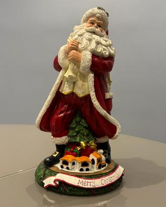 Babbo Natale con un sacco di doni in spalla
