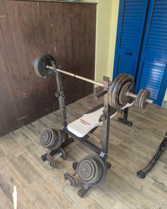 Panca, due bilancieri, 6 manubri e 166 kg di ghisa