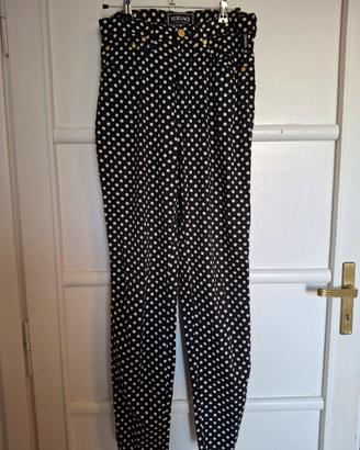 Pantalone Versace nero a pois bianchi