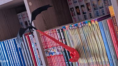 Drago con fiamma a sbalzo per librerie
