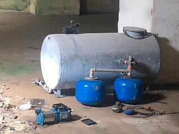 cisterna acqua e portoni di ferro battuto 