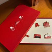 Set di sette spille omega con scatola