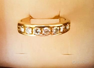 anello rivière con 7 brillanti oro giallo 18 kt