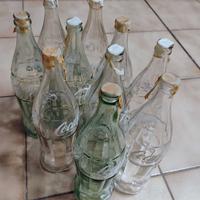 Bottiglie Coca-Cola anni '60