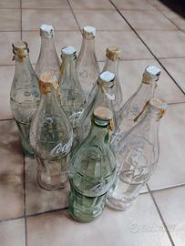 Bottiglie Coca-Cola anni '60