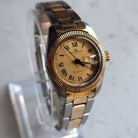 Baume Mercier   baumatic acciaio oro