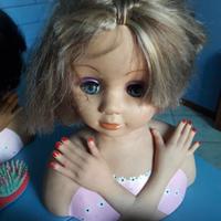 Teste bambola giocattolo