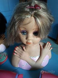 Teste bambola giocattolo