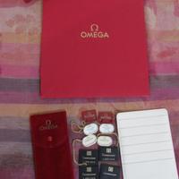 OMEGA KIT.PORTA GARANZIE.E TAG. PIU POSCHETT.