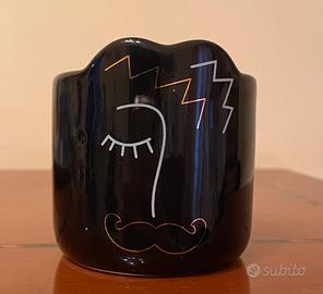 Candela con viso di uomo