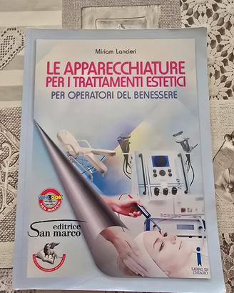 libro e apparecchiature per i trattamenti estetici