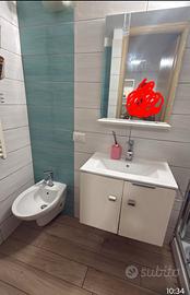 camera con bagno e angolo cottura 