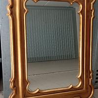 Specchio con cornice in legno dorata
