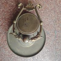 antico porta orologio in bronzo