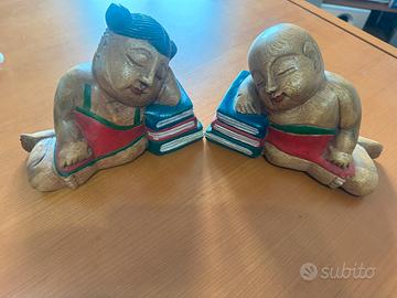 Coppia di fermalibri in legno