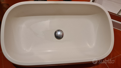 Lavabo da appoggio design in pietra scavata ovale