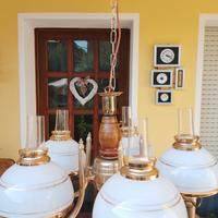 lampadario in bronzo con cupole di vetro