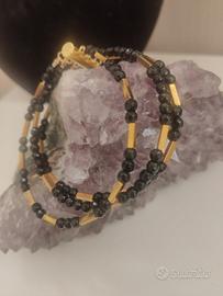 bracciale tre fili cristalli e acciaio nero e oro