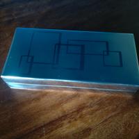 Scatola in acciaio simil Charlotte Olympia Geometr