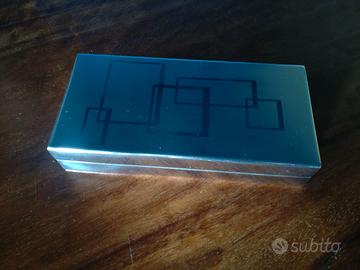 Scatola in acciaio simil Charlotte Olympia Geometr