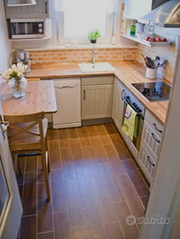 Terreno con casa abitabile