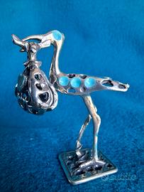 Cicogna in argento 800 con fagotto mobile e smalti